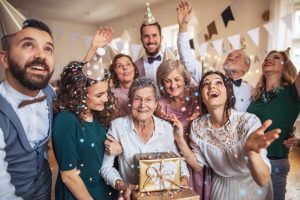 Family celebrating an elderly woman's birthday