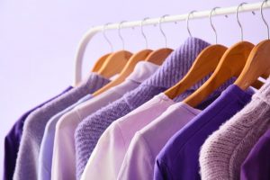 Clothing rack full of purple clothes