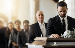 Line of people waiting to pay their respects at a funeral service