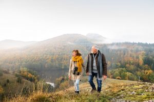 Couple walking in the mountains during the fall