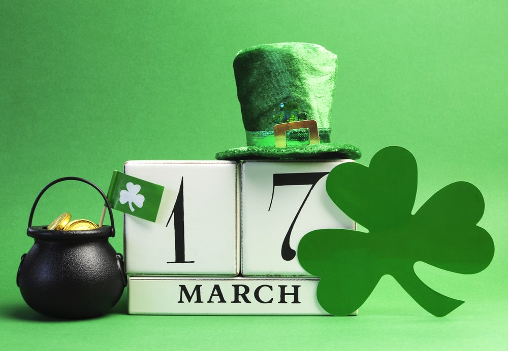 Calendar with March 17 with shamrock, leprechaun hat, and pot of gold for St. Patrick's Day