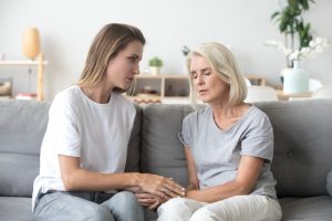 younger woman supporting her mother