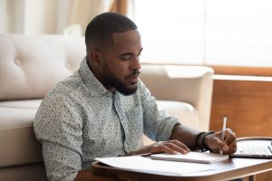 Man making a plan in a notebook