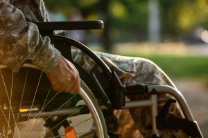 Service member sitting in wheelchair