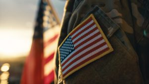Focus on patch of American flag on service member's shoulder