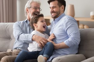 Father, adult son, and grandson enjoying time together