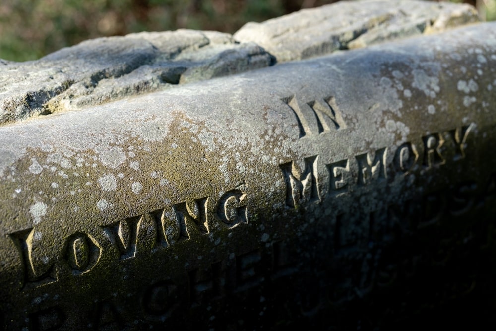 Headstone that says "In Loving Memory" on it