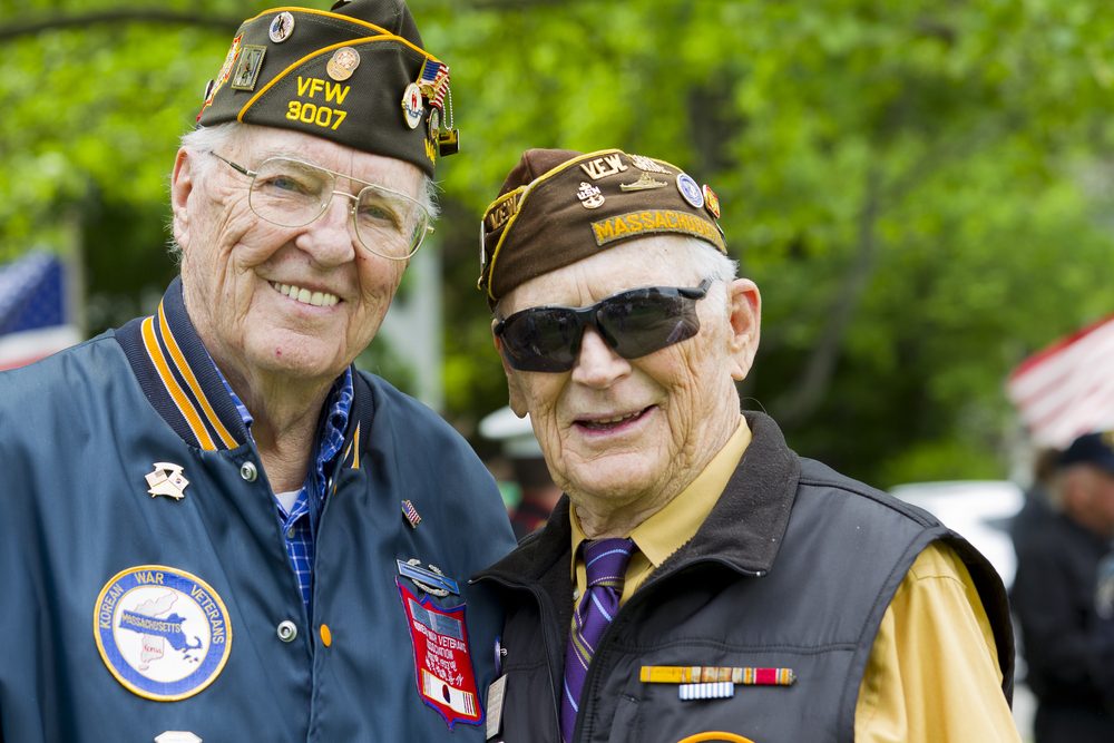 Two older veterans, smiling