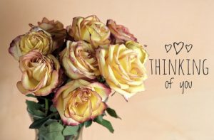 bouquet of yellow roses tipped in pink