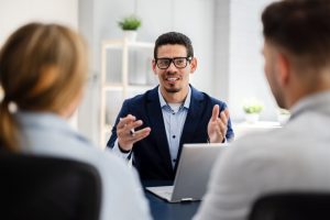 Couple talking with funeral professional