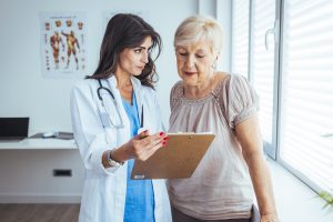 Female patient discussing her medical care with female doctor