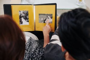 Looking at wedding photos in an old photo album