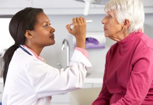 Senior woman visiting eye doctor