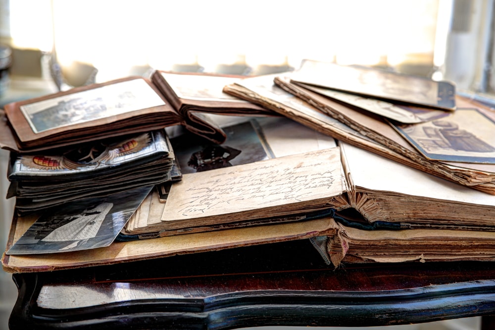 Creative sympathy gifts: photos albums on a table, pick one to give to grieving family