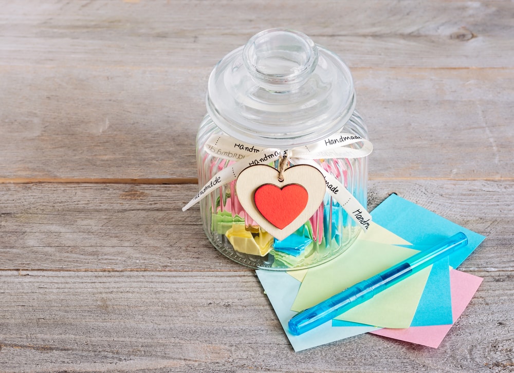 Creative sympathy gifts: a glass jar filled with encouraging notes