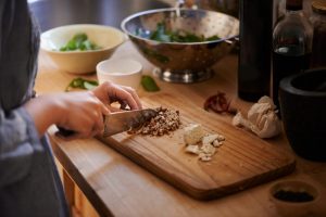 Woman chopping in the kitchen as she preps a meal