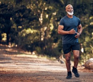 Man running along a nature path on a clear summer's day