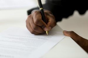 Person signing contract