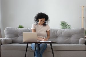 to show a woman taking time to write and remember a loved one