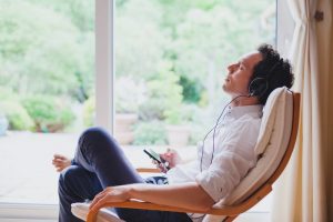 to show a man listening to music and remembering a loved one