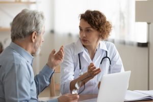 shows man talking to his doctor about his health