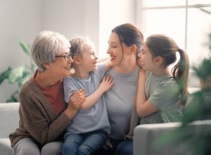 Shows grandmother, daughter, and grandchildren living with peace of mind