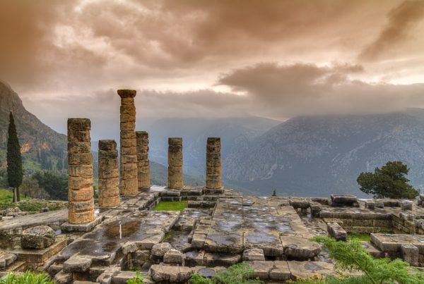 View of ruins of Ancient Greece with beautiful, dark cloudy sky