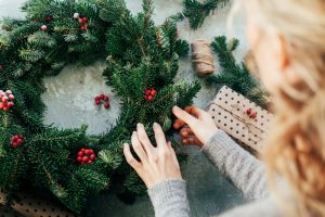 woman making a Christmas wreath