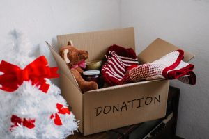 toys and socks in a cardboard donation box
