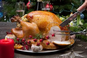 carving a christmas turkey with family