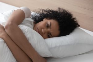 Woman laying in bed, having trouble sleeping