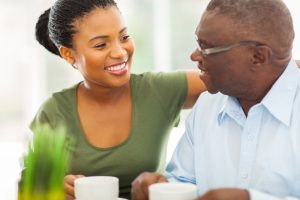 woman helping senior man