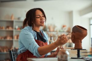 Young woman creating a sculpture in an art studio