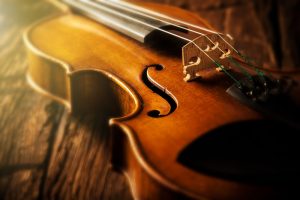 Violin laying on a wooden table