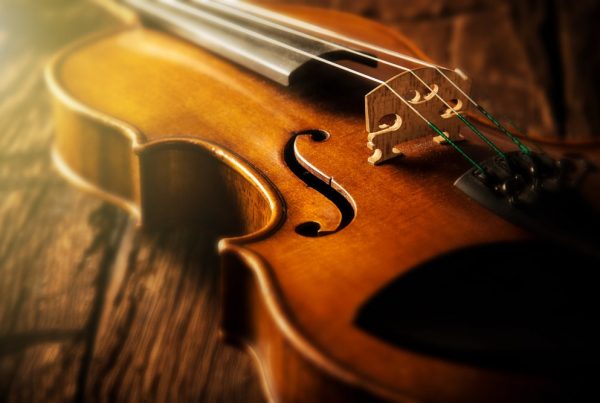 Violin laying on a wooden table