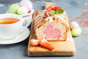 Shows a delicious loaf of strawberry bread with bunny shape in the middle