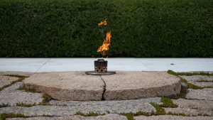 Shows Eternal Flame at John F. Kennedy's gravesite