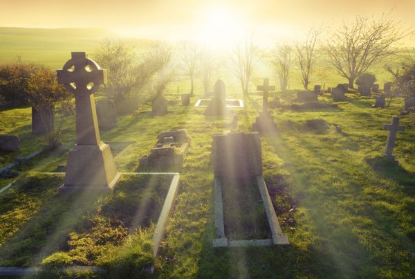 cemetery with bright sunrise behind