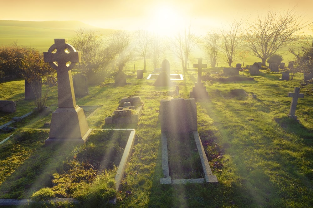 cemetery with bright sunrise behind