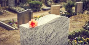 grave with peach flower on top