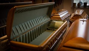 Shows example of a full-couch casket with the lid fully open in one piece