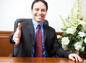 Portrait of a smiling man in his studio