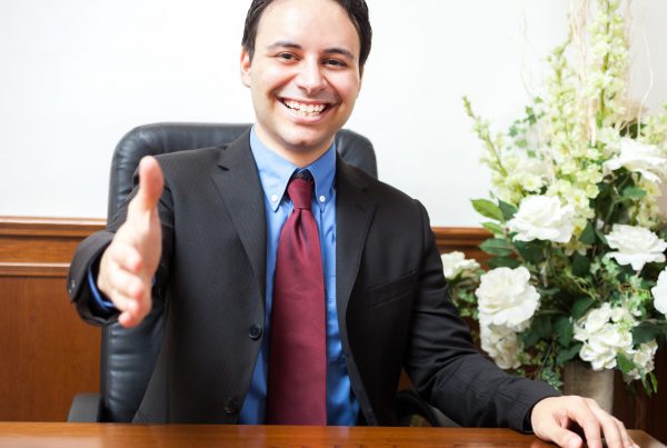 Portrait of a smiling man in his studio