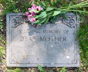 headstone for a mother with pink flowers on it