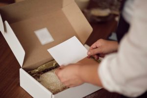 person opening a gift box