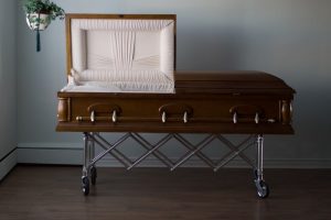 Shows example of a half-couch casket with top half of lid open