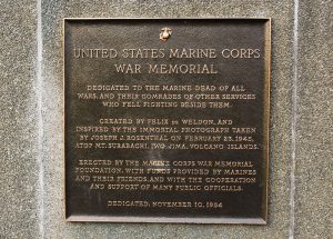 Shows dedication plaque that is affixed to Marine Corps War Memorial