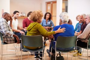 Grief support group of senior adults, sitting in circle