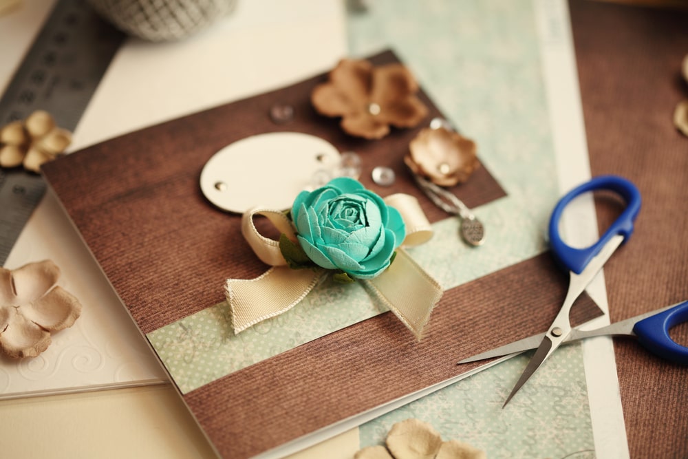 scrapbook on a table with scissors