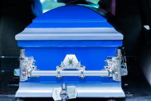 Bright blue casket with silver accents to showcase a custom casket idea